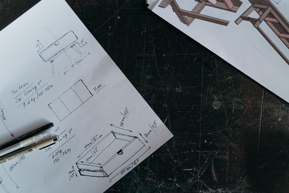 Blueprints and fabric swatches for a custom sofa design